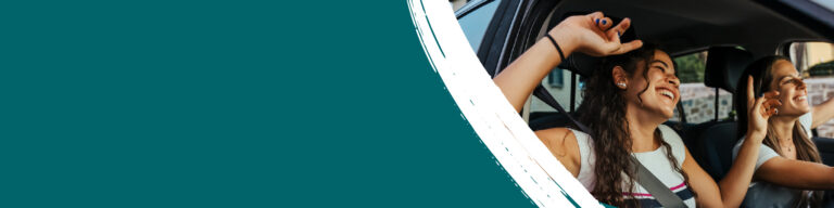 Two people in a car joyfully raise their hands, smiling and laughing. The background is a teal color, enhancing the lively, carefree atmosphere.
